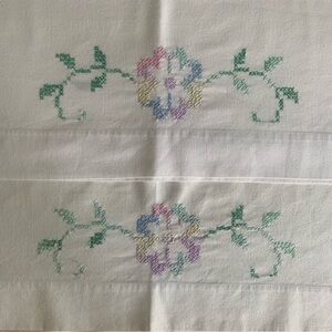 Pillowcase pair, vintage cross-stitched by hand